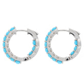 Round blue turquoise sterling silver earrings with sparkling accents, showcasing elegant craftsmanship.